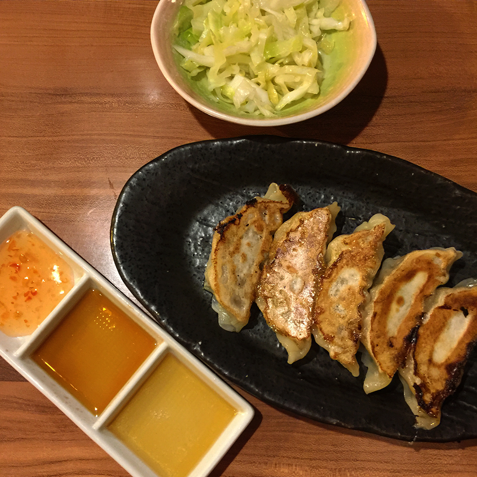 Pork gyoza and cabbage slaw to accompany my ramen | Kyoto, Japan